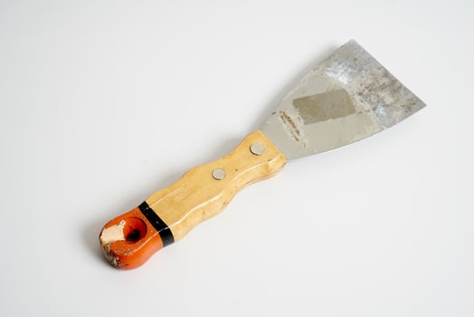 construction spatula with wooden handle photo