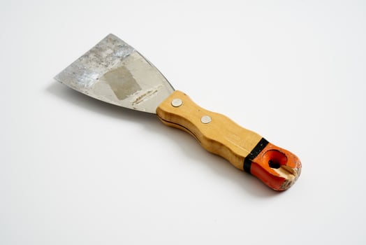 construction spatula with wooden handle photo