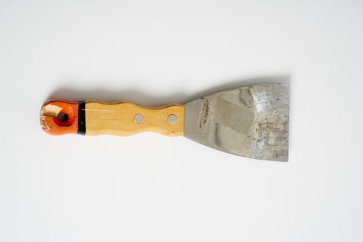 construction spatula with wooden handle photo