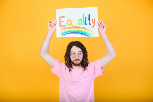 Portrait of a gay man on a colored background. Gender equality. The concept of the LGBT community. Equality. photo