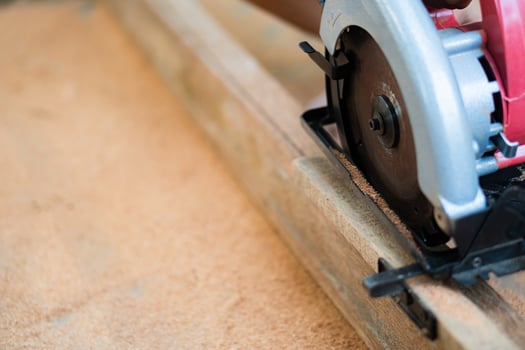Circular saw cutting wood photo
