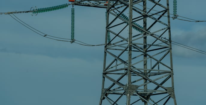 High voltage towers with sky background. Power line support with wires for electricity transmission. High voltage grid tower with wire cable at distribution station. Energy industry, energy saving photo