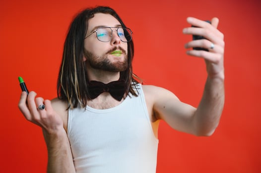 Gay man doing makeup. The concept of the LGBT community. Equality. photo