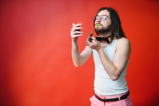 Young, handsome gay man on a colored background in the studio. LGBT concept. photo