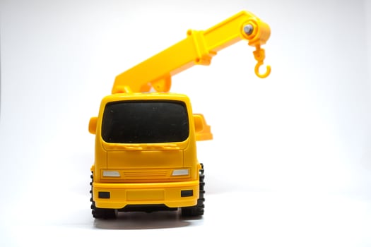 Yellow truck crane isolated on white. Truck crane for kids photo