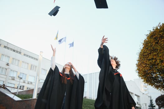 Portrait of two happy graduating students. photo
