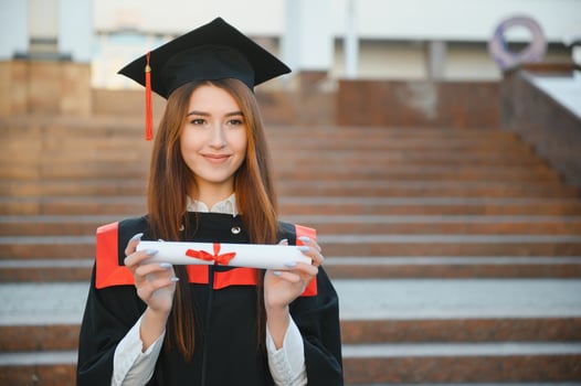 Woman portrait on her graduation day. University. Education, graduation and people concept. photo