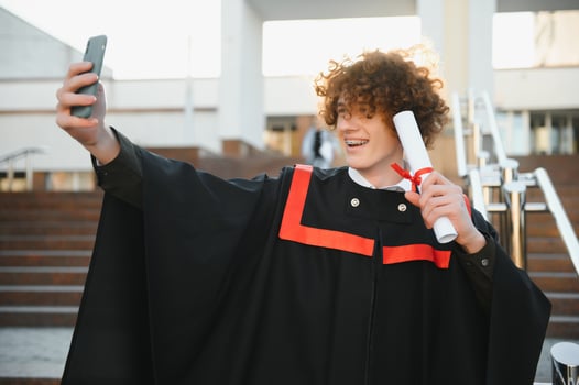 Portrait of a confident and joyful young graduate with a diploma. Man is ready for the next step in his life. photo