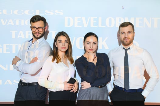 group of business people on the background of motivational words photo
