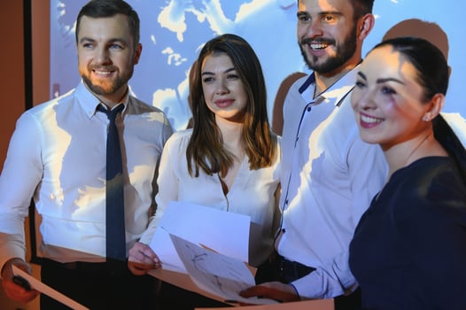 Image of businesspeople standing against world map background photo