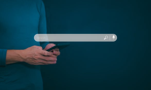 Information search technology, search engine optimization, male hand using a smartphone to search information, using the search bar function on your website photo