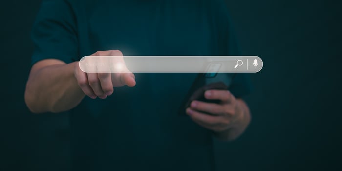 Information search technology, search engine optimization, male hand using a smartphone to search information, using the search bar function on your website photo