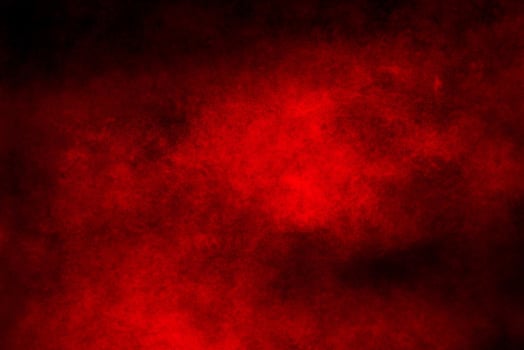 Crimson Powder Burst on Dark Background photo
