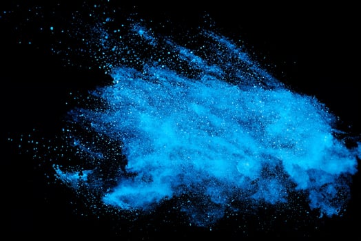 High-speed Capture of Blue Powder Explosion on Black Background photo