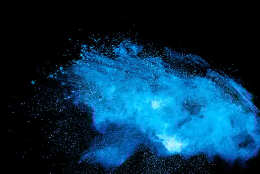 High-speed Capture of Blue Powder Explosion on Black Background photo