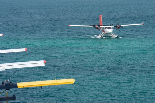 Seaplanes floating dock at Male airport, seaplanes in ocean lagoon. photo