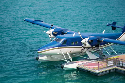 Seaplanes floating dock at Male airport, seaplanes in ocean lagoon. photo