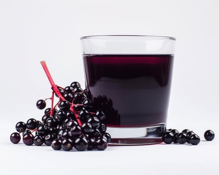 black elderberry juice on white background photo