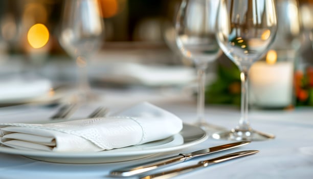 Elegant Table Setting with White Napkin and Silverware photo