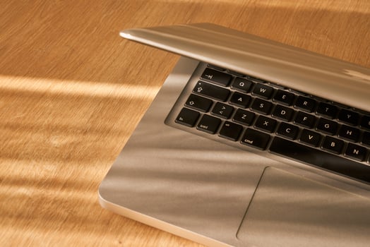 metallic grey laptop on a table photo