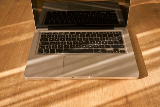 metallic grey laptop on a table photo