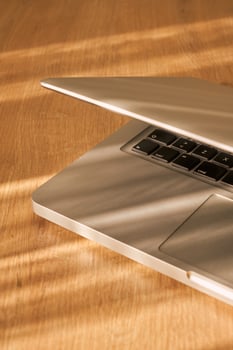 metallic grey laptop on a table photo