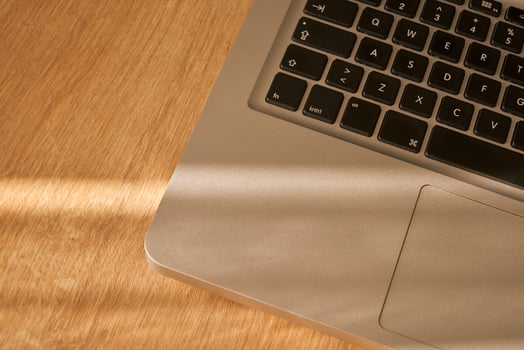 metallic grey laptop on a table photo