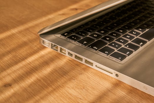 metallic grey laptop on a table photo