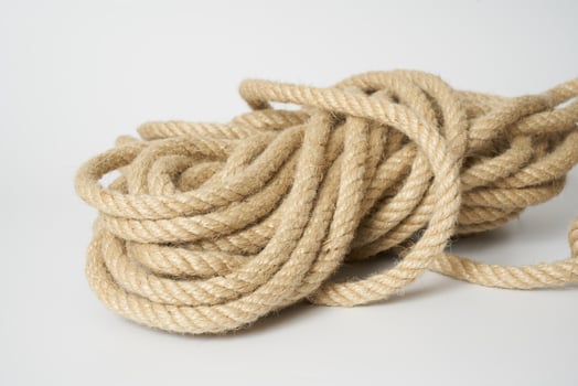 brown rope on white background photo