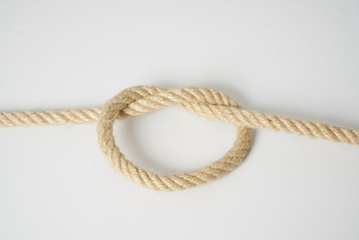 brown rope on white background photo
