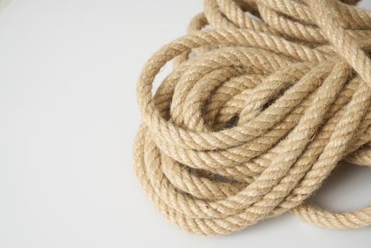 brown rope on white background photo