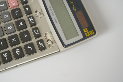 retro calculator on white background photo