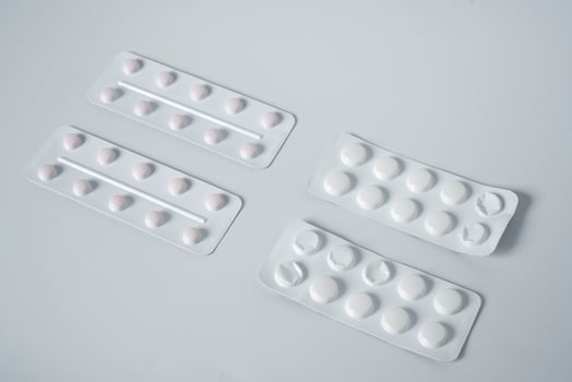 Painkillers on white background photo