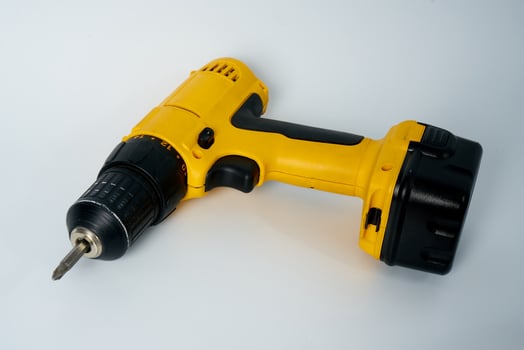 Yellow and black cordless drill. photo