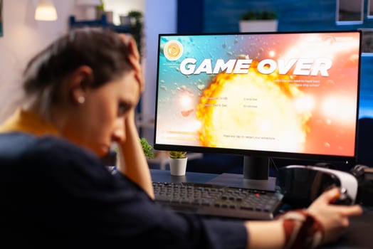 Caucasian gamer losing space shooter videogame competition on professional powerful computer. Professional pro gamer streaming online game with new graphics using modern equipment photo
