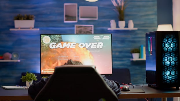 Upset professional woman gamer wearing headset losing space shooter game in cybersport competition. Tired pro cyber player gaming online games on powerful personal computer with RGB lights. photo