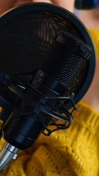 Close up of influencer discussing with fallowers during live on social media recording vlog. On-air online production internet broadcast show host streaming live content, blogger during livestreaming photo