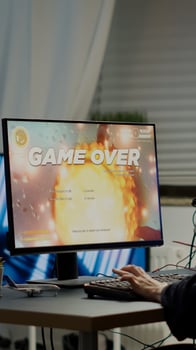 Furious pro woman gamer with headset losing space shooter game with new graphics during gaming championship playing from home at RGB powerful personal computer, performing at esports tournament photo