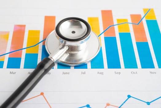 Stethoscope on spreadsheet and graph paper, Finance, Account, Statistics, Investment, Analytic research data economy and Business company concept. photo