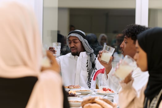 A traditional and diverse Muslim family comes together to share a delicious iftar meal during the sacred month of Ramadan, embodying the essence of familial joy, cultural richness, and spiritual unity photo
