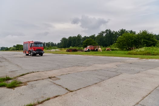 In this captivating scene, a state-of-the-art firetruck, equipped with advanced rescue technology, stands ready with its skilled firefighting team, prepared to intervene and respond rapidly to photo
