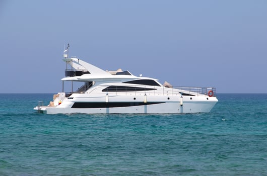 luxury white motor yacht sits far offshore in the Mediterranean Sea. Boat trip. Travel and recreation on the water. Ship in the blue sea, ocean photo