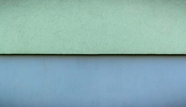 The walls are made of cement, painted in two colors top green, bottom blue. photo
