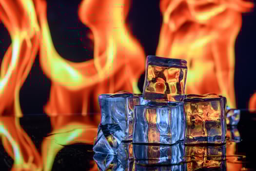 ice cubes against the background of fire, fire and ice, 2 photo