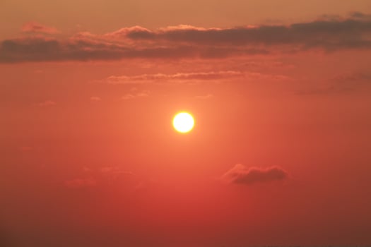 Sunrise on a sunny day with orange sky clouds photo