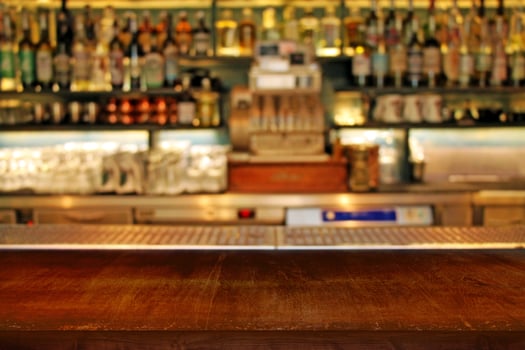 Interior of bar close-up. Classic defocused bar counter background. photo