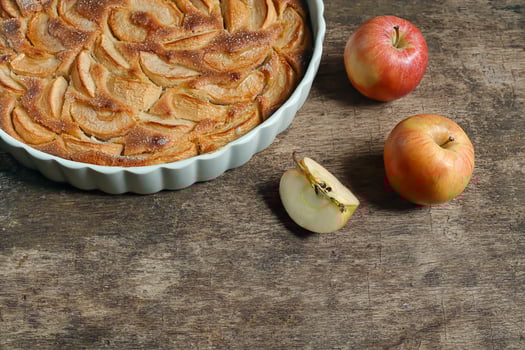 Traditional french apple tart on an wooden background photo