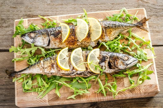 Grilled mackerel with basmati rice and fresh arugula photo
