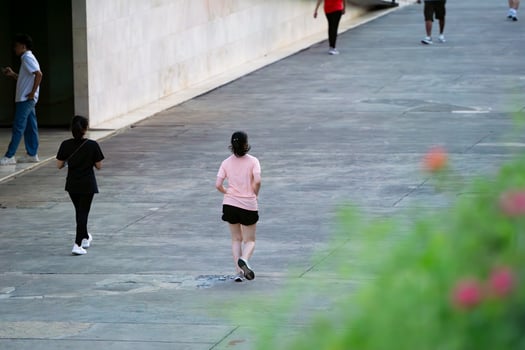 Jakarta, Indonesia, 2024 - Woman Jogging in Lapangan Banteng Park in Morning Workout Routine photo