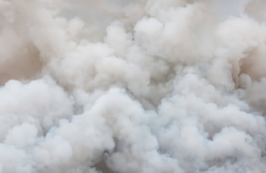 Dynamic Close-Up of Swirling White and Billowing Black Smoke Background photo
